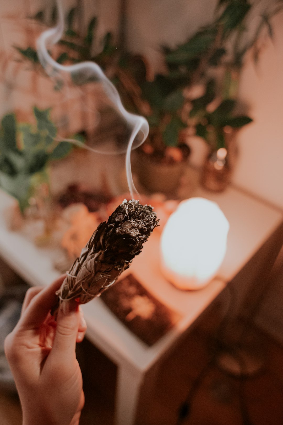 A cozy candlelit home, symbolizing energy house cleansing