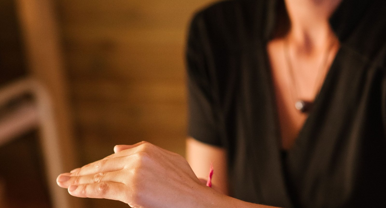Two hands reaching toward each other, symbolizing reconnection and wound healing